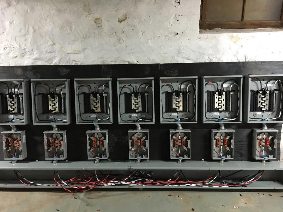 Row of electrical panels installed by FDA Electric